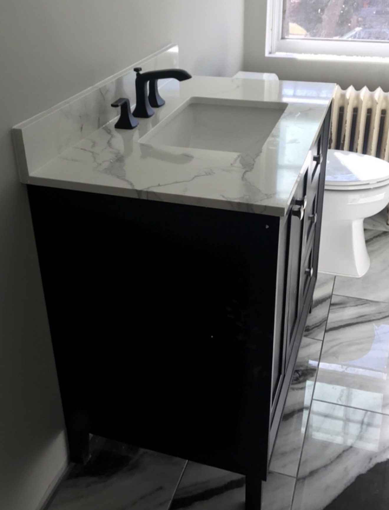 Modern bath vanity with black fixtures