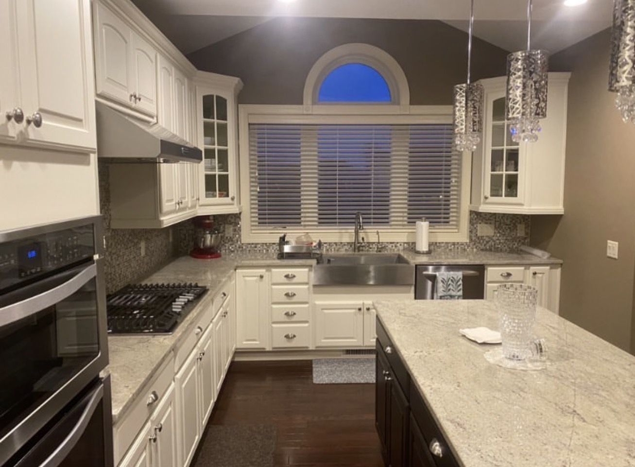 Cream-cabinet kitchen with granite counters