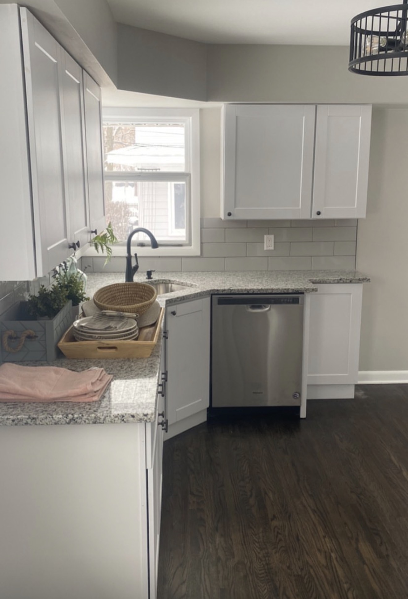Small white kitchen with stainless appliances